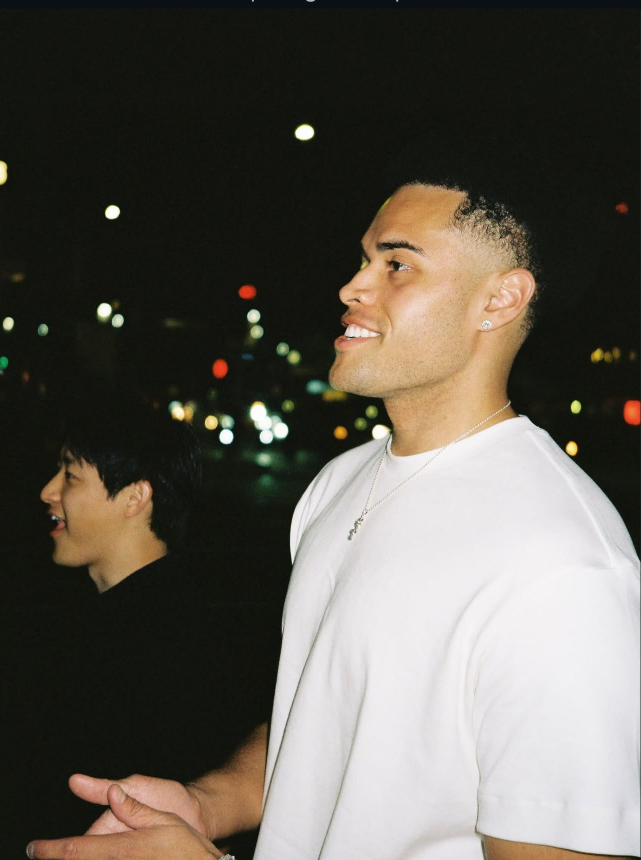 Christian Fong standing and smiling